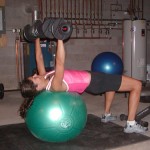 Julie performing a Dumbell Swiss Ball Chest Press