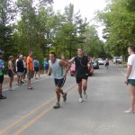 Julie's husband Tim, tagging Brad in a team marathon in Michigan